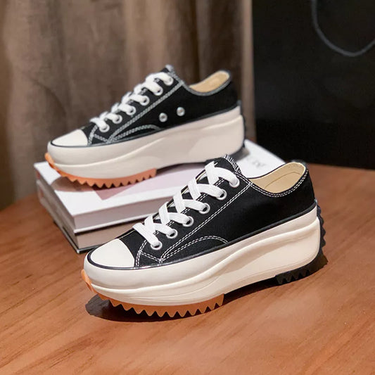 Women's thick-soled canvas shoes in white, black, and black high top options