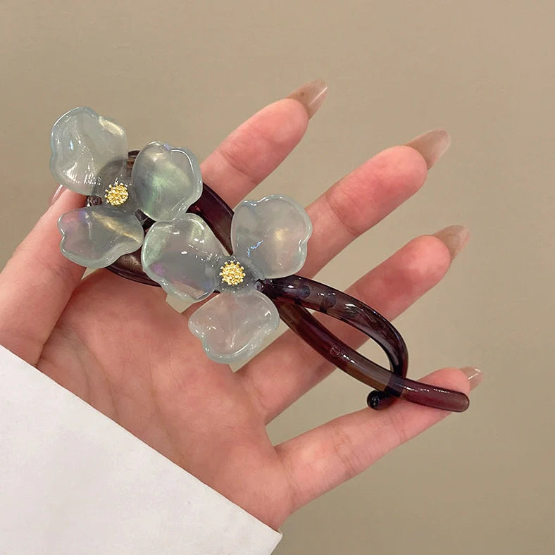 Retro flower bobby pin with acrylic petals in blue, light blue, beige, and pink colour options