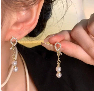 Gold electroplated floral earrings with pearl accents on S925 silver posts