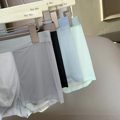 Ultra-thin seamless men's boxers in black with a honeycomb crotch design, laid flat.
