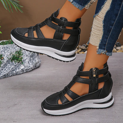 Black women's close-toed platform sandals with hollow-out design and Velcro strap.