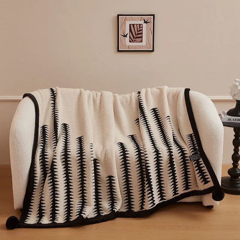 Black and white cationic panda pattern velvet blanket showing texture and modern design