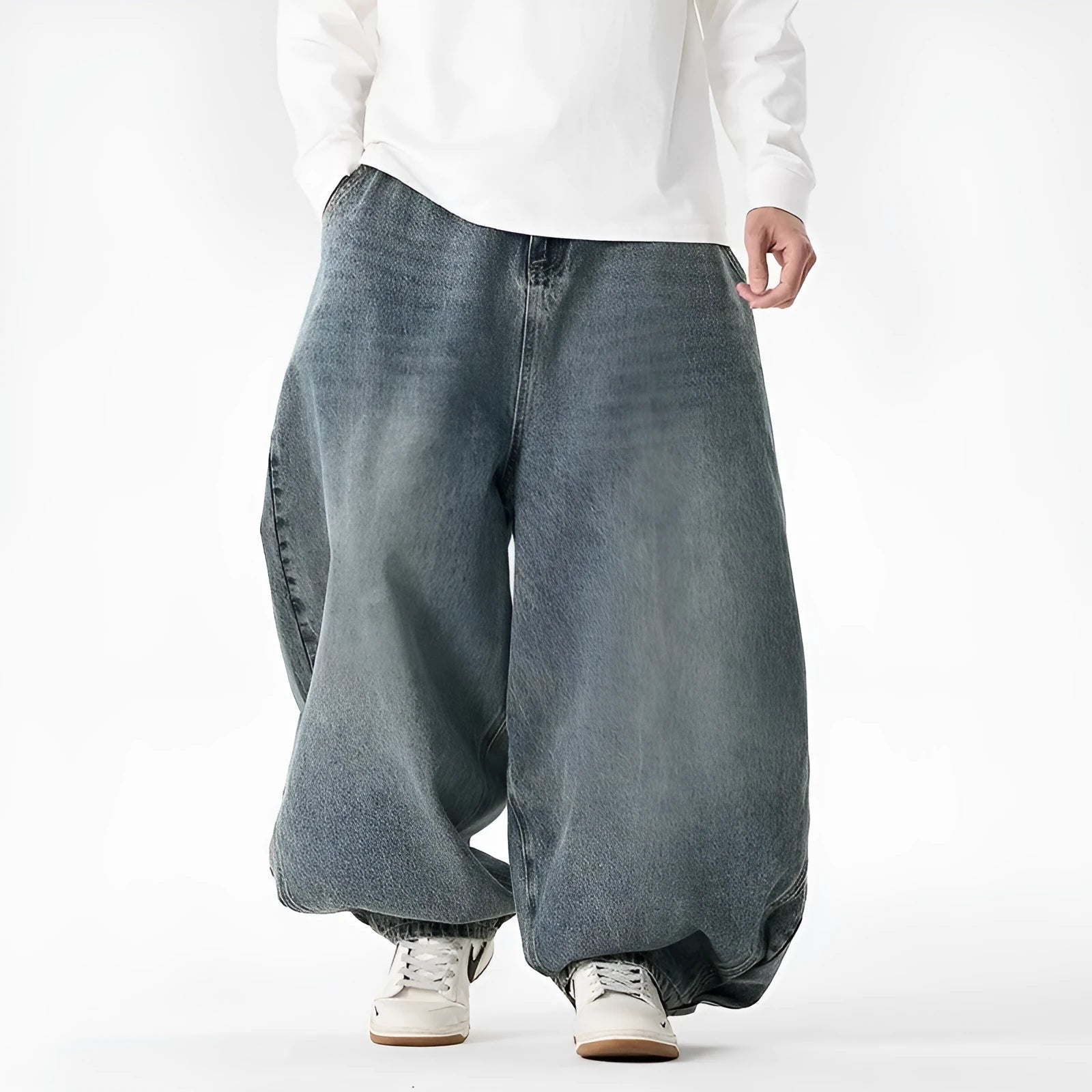 Men's plus-size light blue wide-leg baggy jeans on a neutral background.