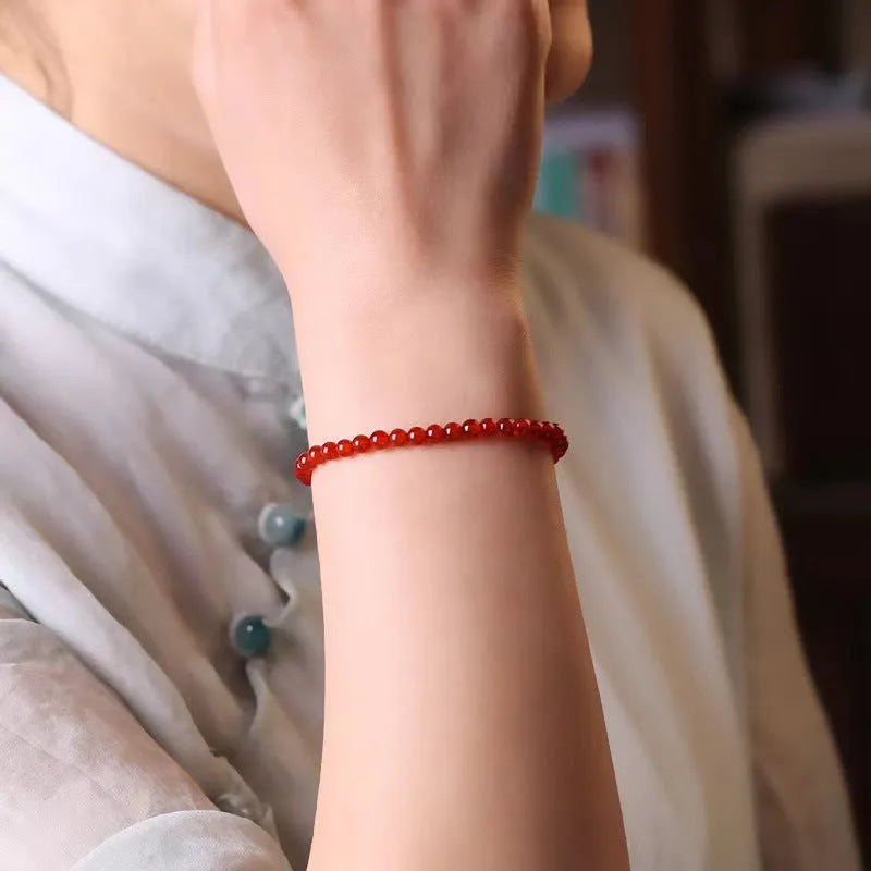 Ultra-thin red agate women's bracelet in classic style on wrist