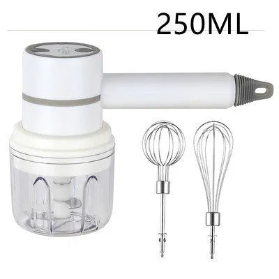 Green rechargeable electric hand mixer with whisk and beater attachments on a kitchen counter