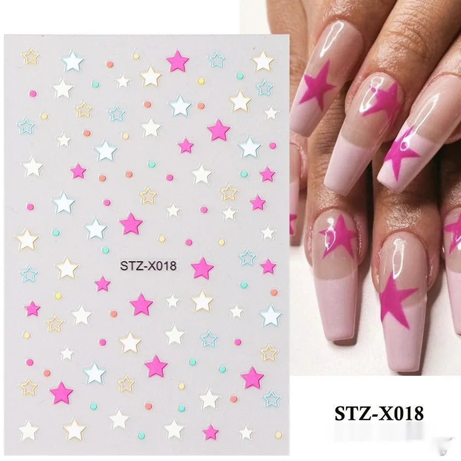 Assortment of black and silver nail sticker designs including cartoon and French tip patterns on a plastic sheet.