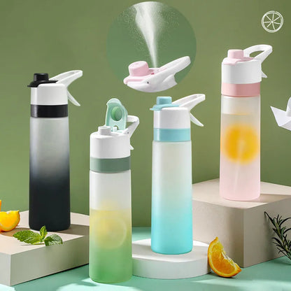 White spray water bottle with black leakproof lid and handle strap on a table