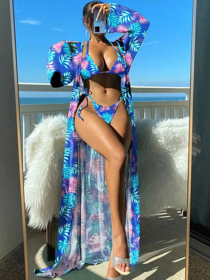 Polyester banded bikini set with long sleeve blouse, briefs, and robe cover-up in floral pattern