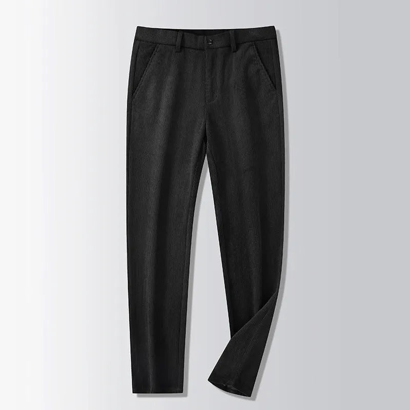 Man wearing khaki and black striped straight-leg retro trousers with a zip fly.