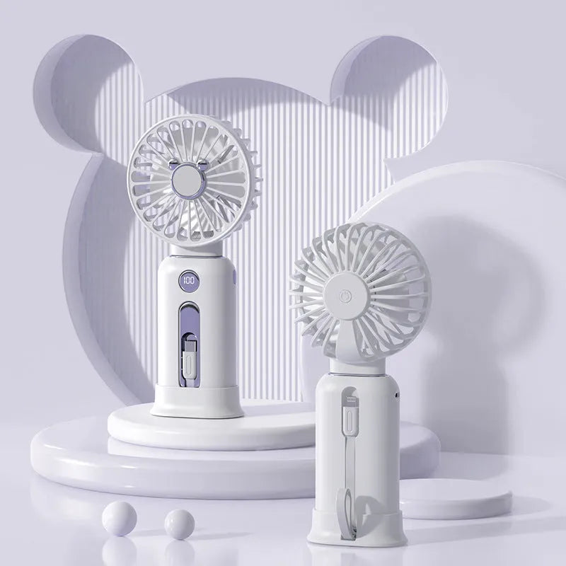 Purple handheld USB fan with power bank ports, shown with a white USB cable.