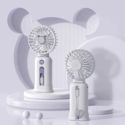 Purple handheld USB fan with power bank ports, shown with a white USB cable.