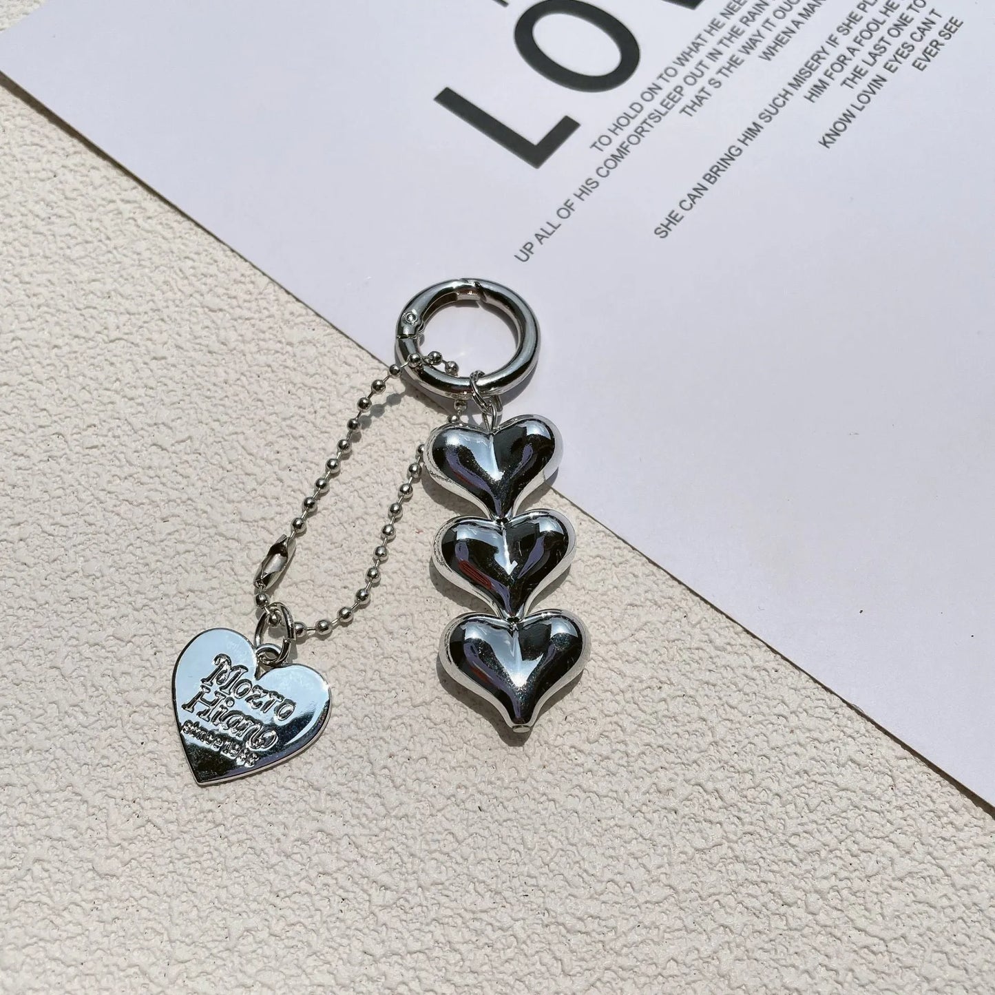 Acrylic peach-shaped key ring with love heart design and electroplated finish