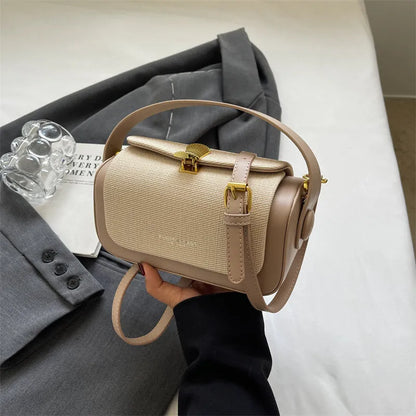 Women's PU leather messenger bag in a horizontal square shape with a lock and adjustable shoulder strap.