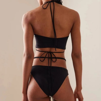 Women's black lace-up bikini swimsuit showing adjustable design and two-piece construction