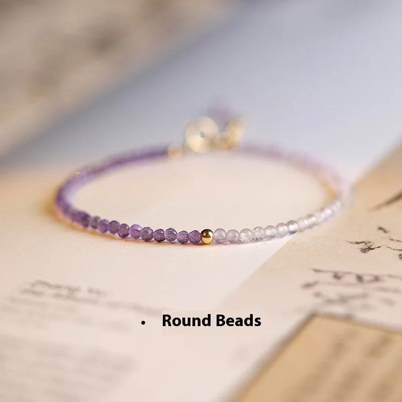 Women's geometric crystal bracelet with cut facets and spherical sections in 2mm purple rattan style.