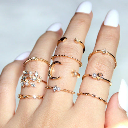 Gold-plated adjustable ring set with moon, star, and leaf charms in a bohemian style