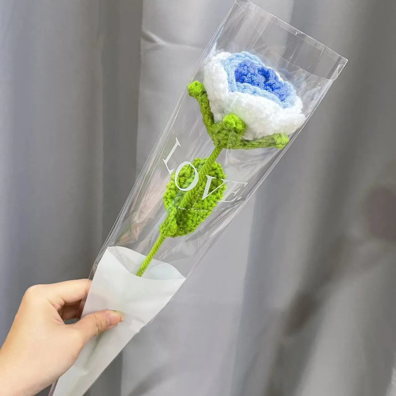 Wool-woven artificial silk rose bouquet in gradient blue colour with textured floral arrangement