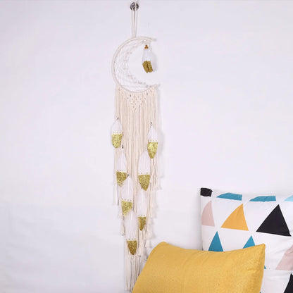 Gold crescent dream catcher wall decoration made from woven cotton thread, 20cm wide by 100cm high.