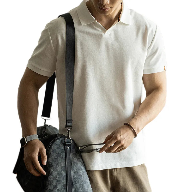 American-style cotton polo shirt in blue, black or white with short sleeves and regular fit