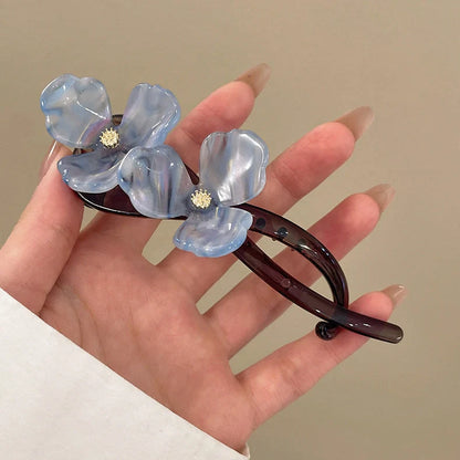 Retro flower bobby pin with acrylic petals in blue, light blue, beige, and pink colour options