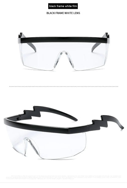 Black one-piece cycling sunglasses with blue polycarbonate lenses and lightning leg temples on a grey background.
