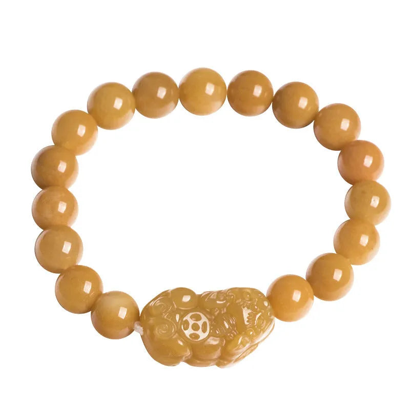 Carved jinsi jade money bracelet in golden thread colour with jade bead detailing