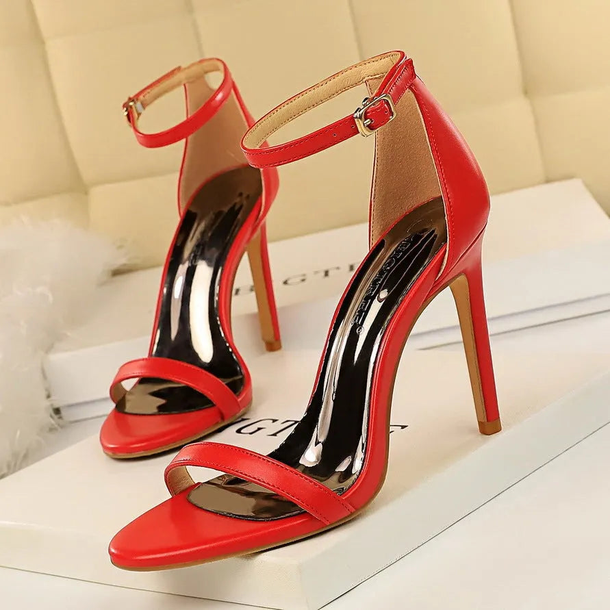 Women's open-toe high heels with an ankle strap and buckle, shown in multiple colours.
