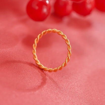 Gold-plated brass women's ring showing twist and simple bracelet styles in matte and glossy finishes.