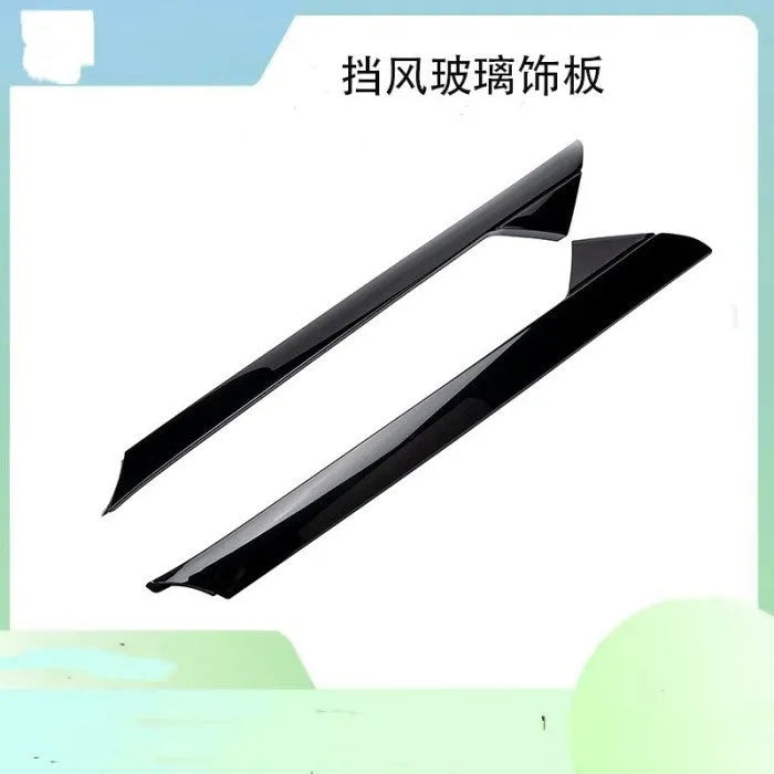 Ford Front Windshield Trim Panel decorative moulding set in black, part numbers BB5Z-7803144-AA and BB5Z-7803145-AA, designed to replace or upgrade the external finishing strip around the vehicle's front windscreen.