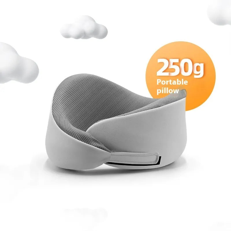 Light grey memory foam U-shaped neck pillow with a magnetic cloth protector.