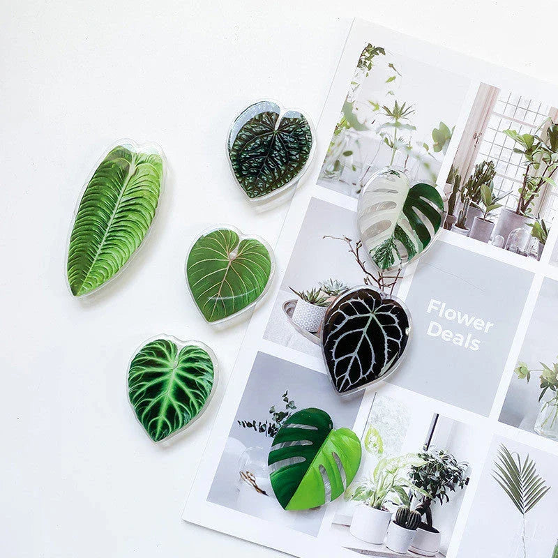 Stylish smartphone stand with leaf-inspired design for secure hands-free support and mobile device versatility