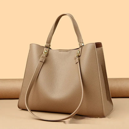 Women's messenger tote bag in horizontal square shape with crossbody strap and internal compartments