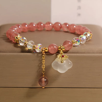 Women's strawberry quartz and white agate crystal bracelet with auspicious cloud charms on elasticated cord