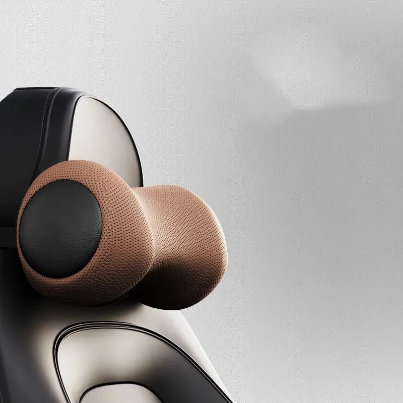 Black car massage cushion with headrest and lumbar support on a car seat, showing wired controller.