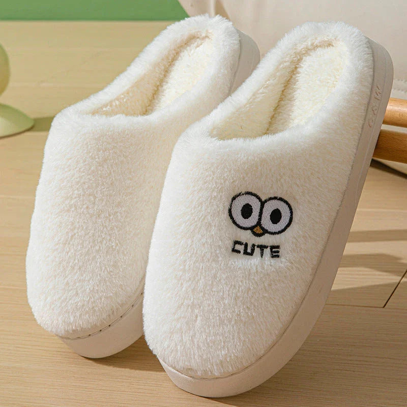 Stylish and cozy cartoon-inspired slippers with plush material and non-slip rubber soles, perfect for keeping feet warm and comfortable at home.