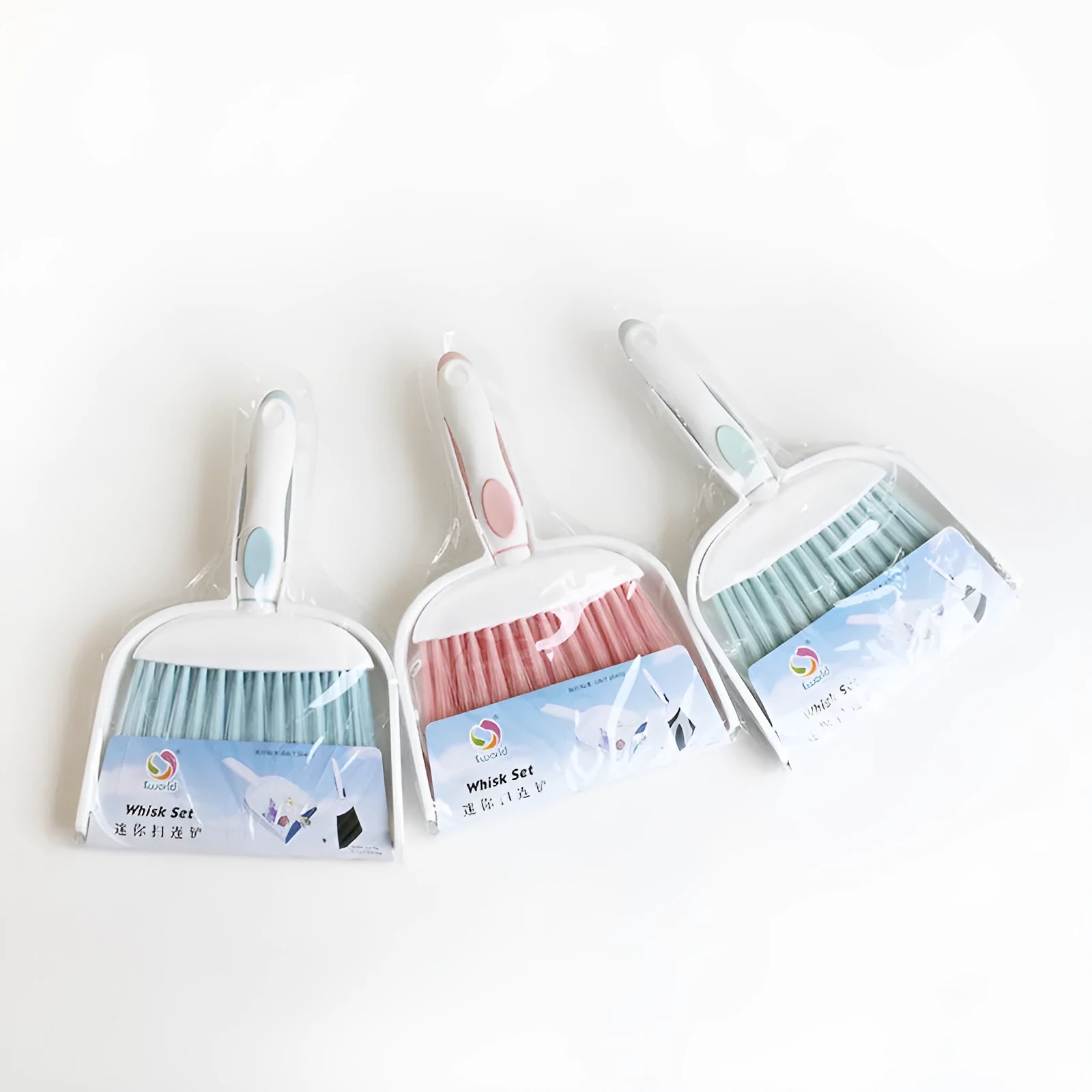 Small plastic handheld dustpan and brush cleaning kit in assorted colours.