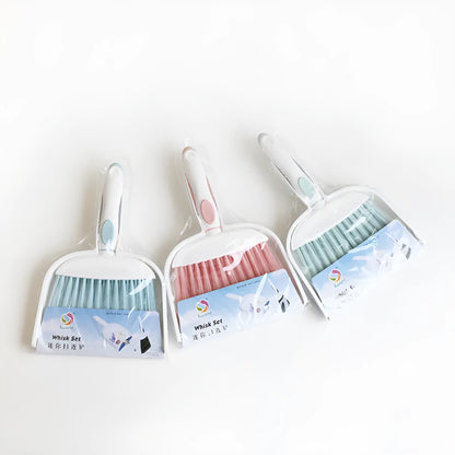Small plastic handheld dustpan and brush cleaning kit in assorted colours.