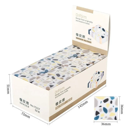 White rectangular rubber brick eraser for students on a blue background.