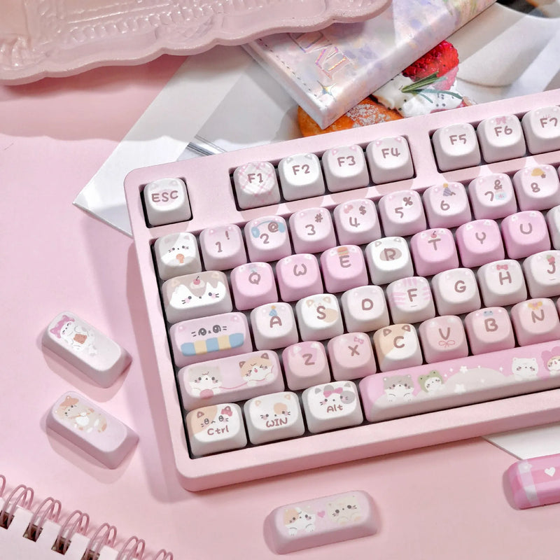 MOA height full five-sided sublimation key cap set in plastic with cartoon style design, available in pink colour for mechanical keyboard customisation and replacement, offering complete top and side coverage for personalised RGB backlit setups