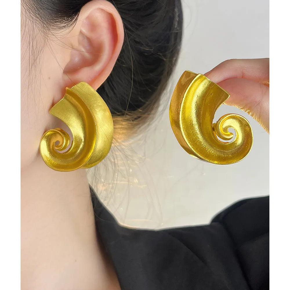 Gold and silver retro geometric alloy ear studs on a white background.