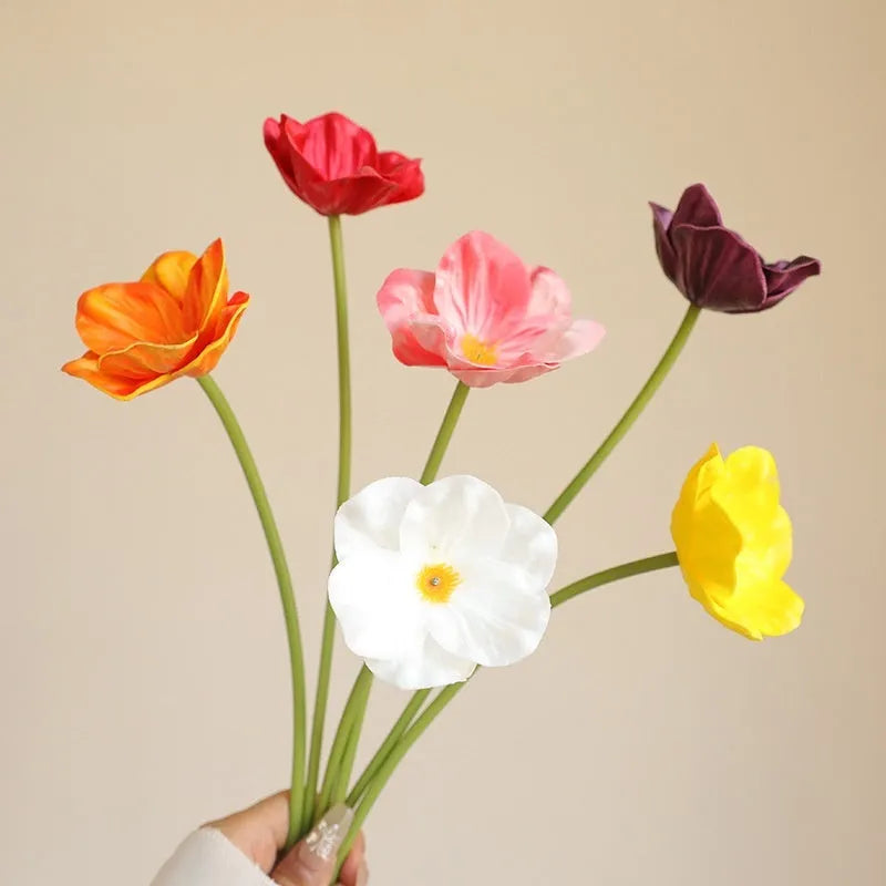 Pack of 15 mini artificial poppy flowers in assorted colours including purple, pink, yellow and red.