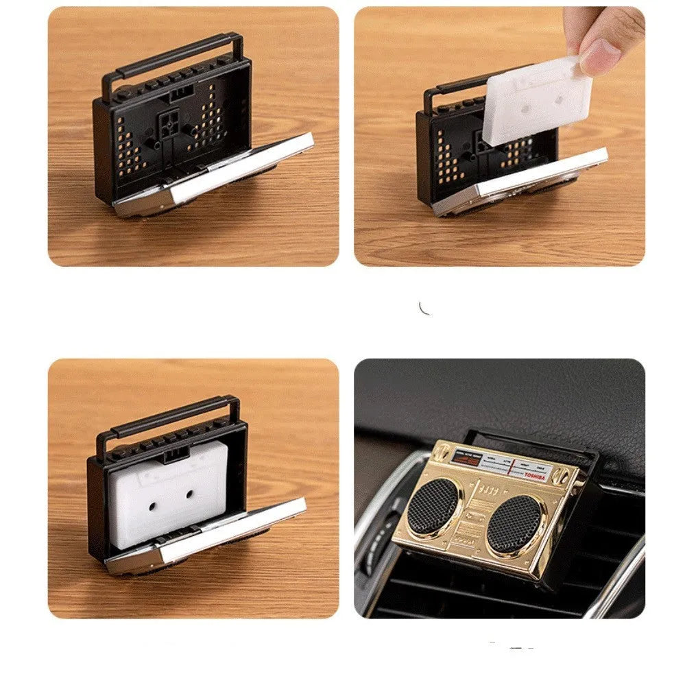 Gold cassette tape car air freshener with zinc alloy construction on car dashboard
