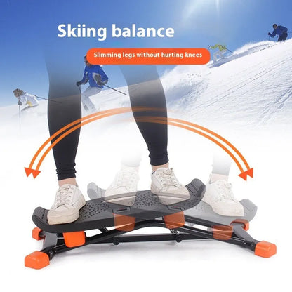 Black JS101A mini indoor skiing exercise machine with elastic hand straps on a carpet.