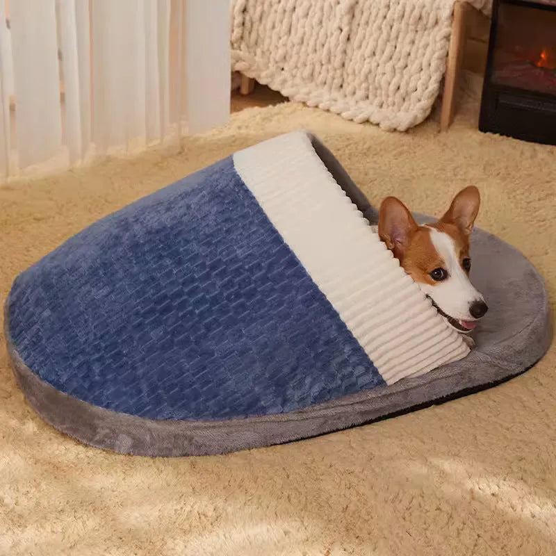 Blue foldable dog nest sleeping bag with removable fleece lining, shown unfolded on a floor.