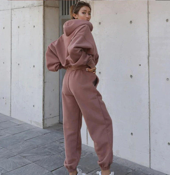 Women's polyester hoodie jacket and sports pants set in various colors for casual and athletic wear