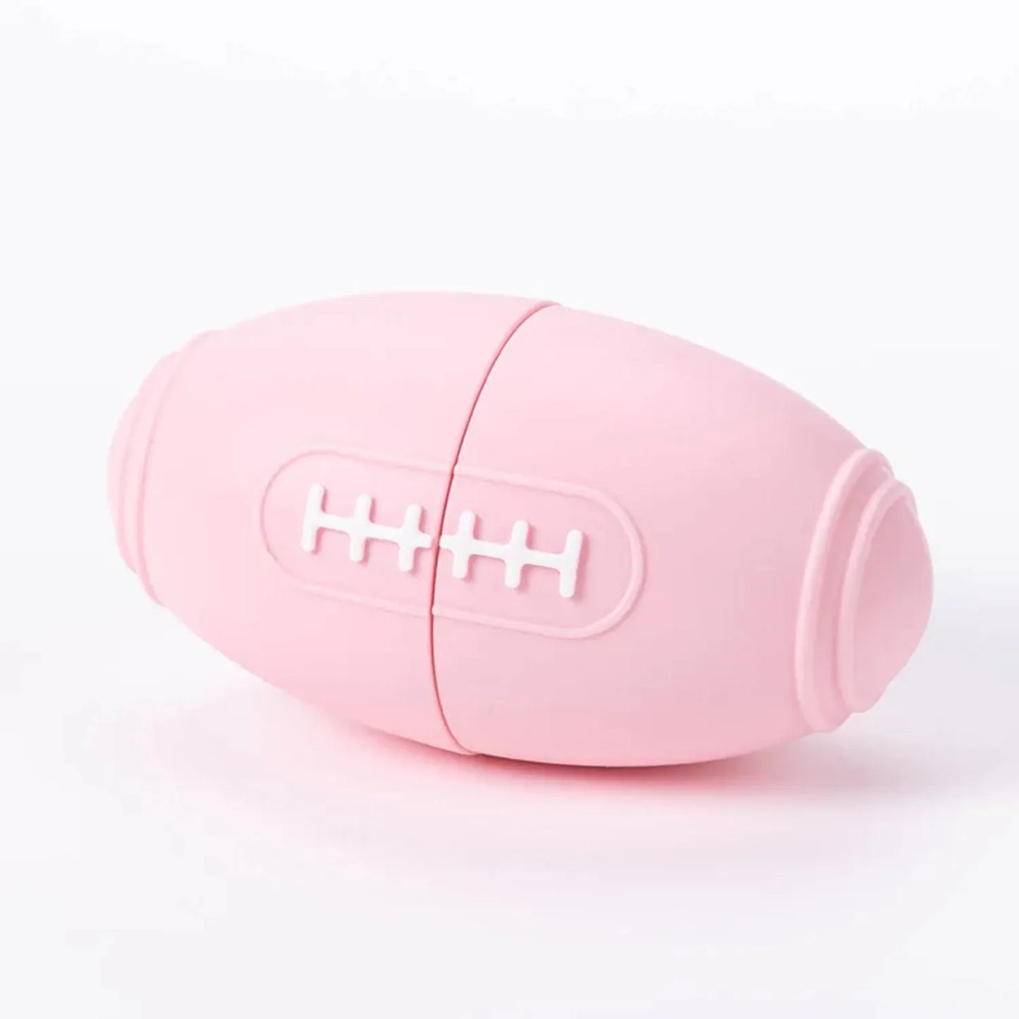 Blue silicone rugby ball dog toy with ridges and hollow centre for treats