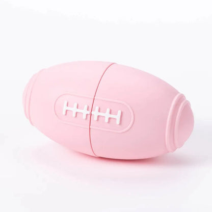 Blue silicone rugby ball dog toy with ridges and hollow centre for treats