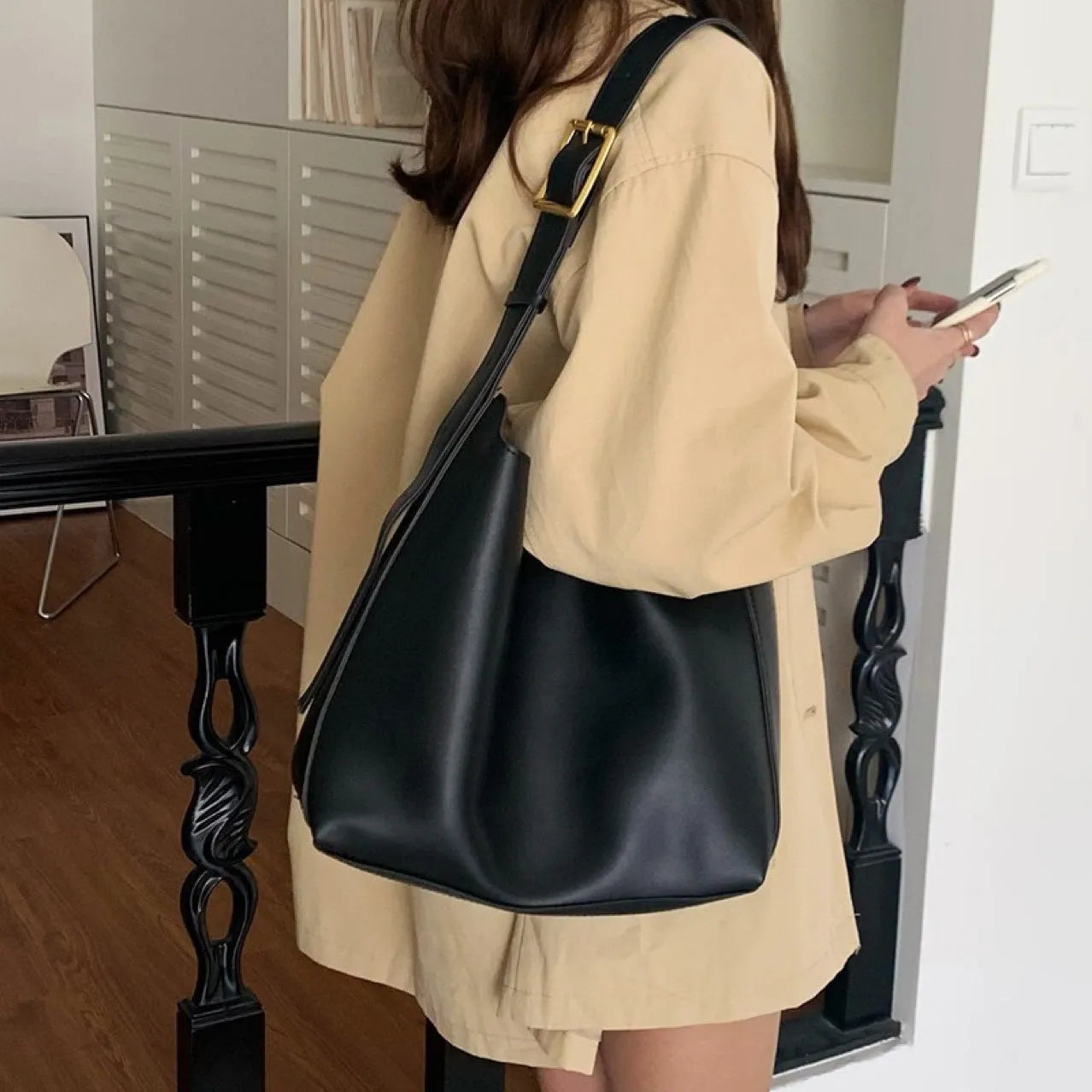 Women's soft PU shoulder bag measuring 28cm by 32cm by 12cm with swing thread details