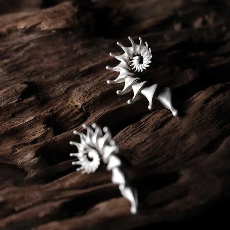 Matte finish conch shell stud earrings with three-dimensional design in alloy metal