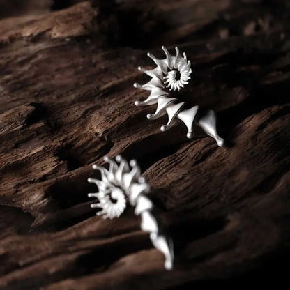 Matte finish conch shell stud earrings with three-dimensional design in alloy metal